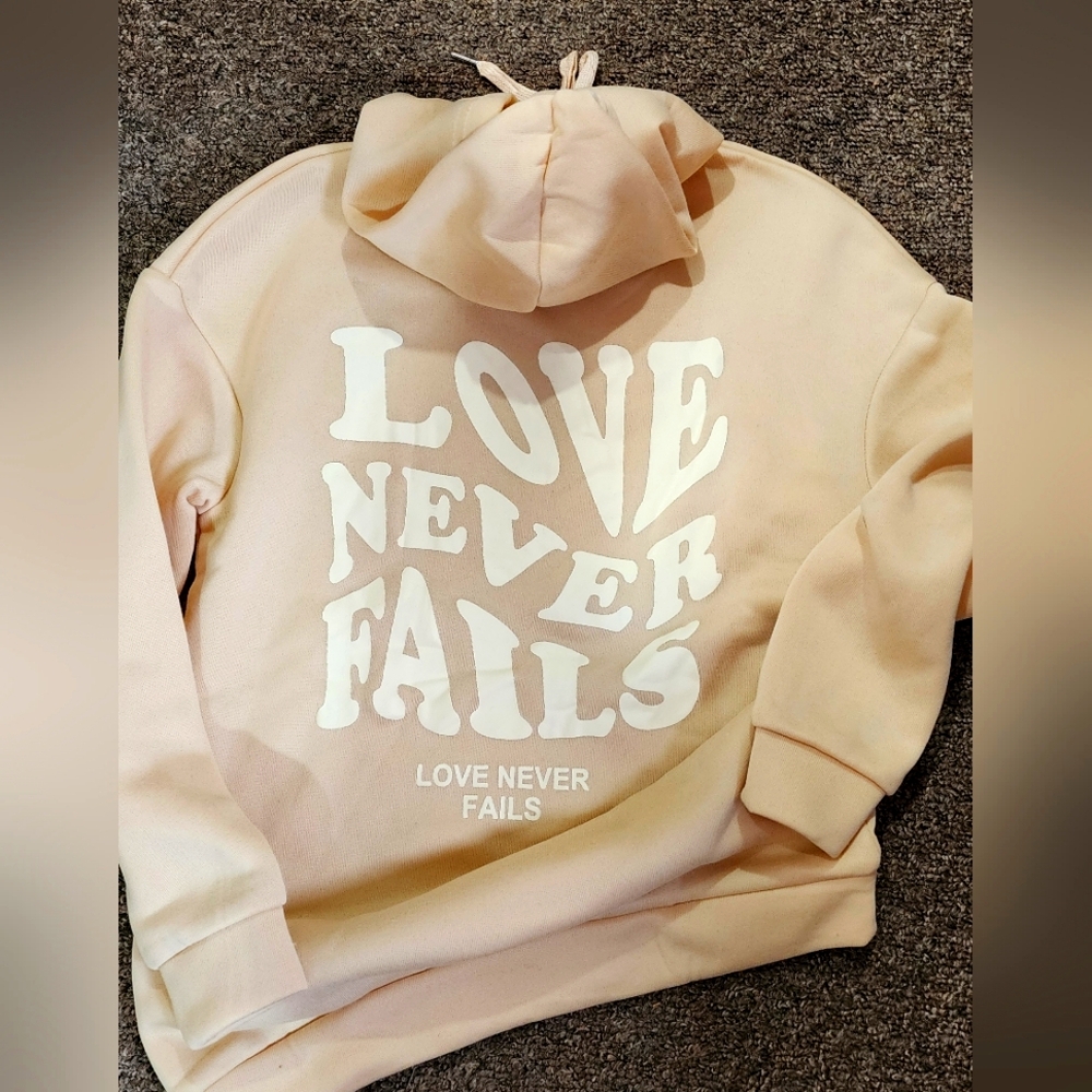 Love Never Fails Cream Hoodie